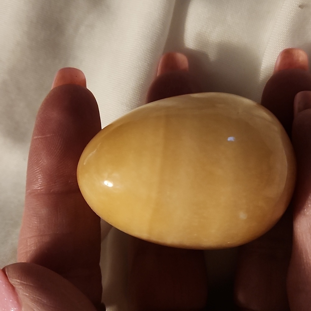 Orange calcite egg with stand